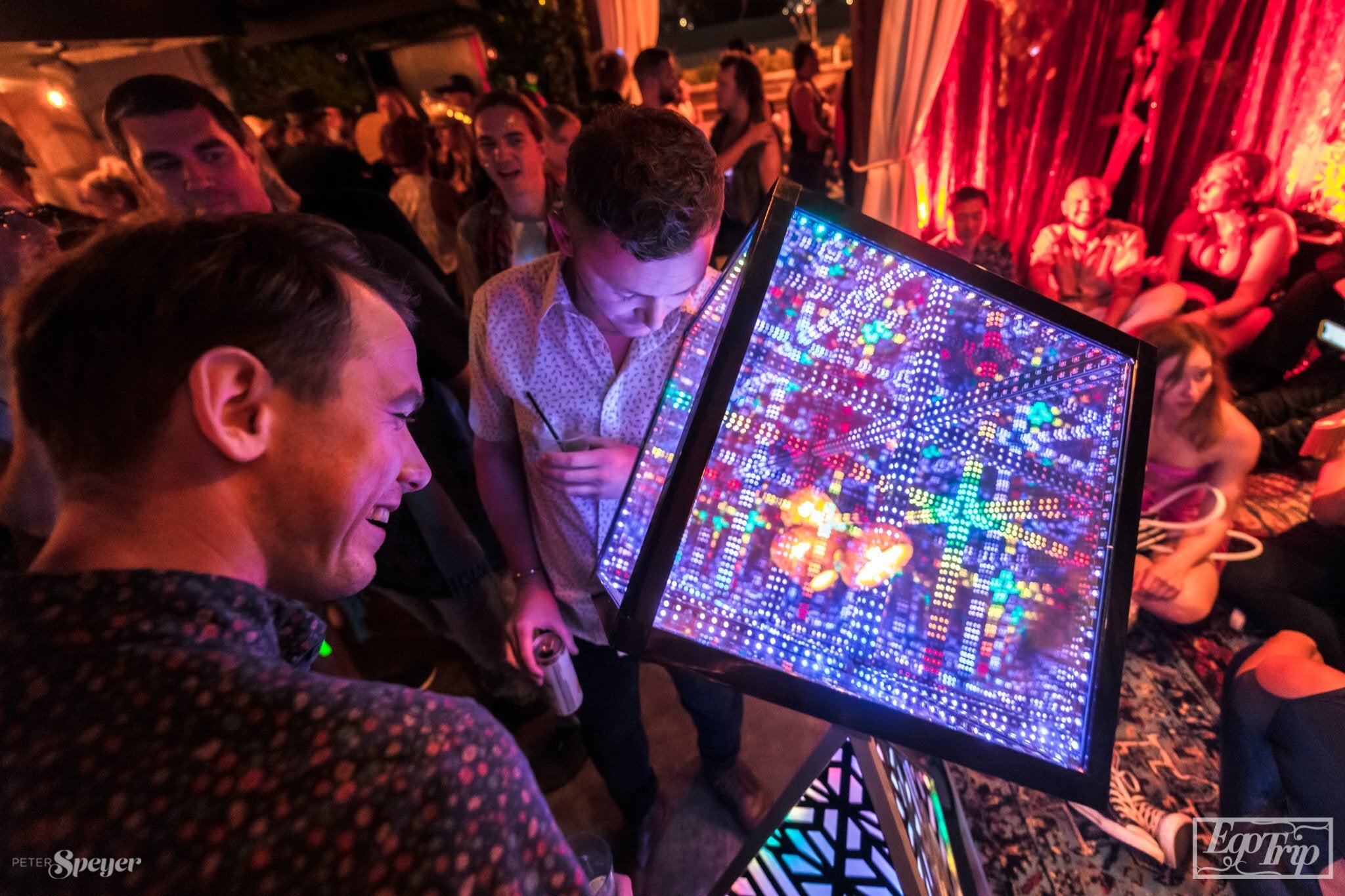 people looking at hypercube 15 at ego trip