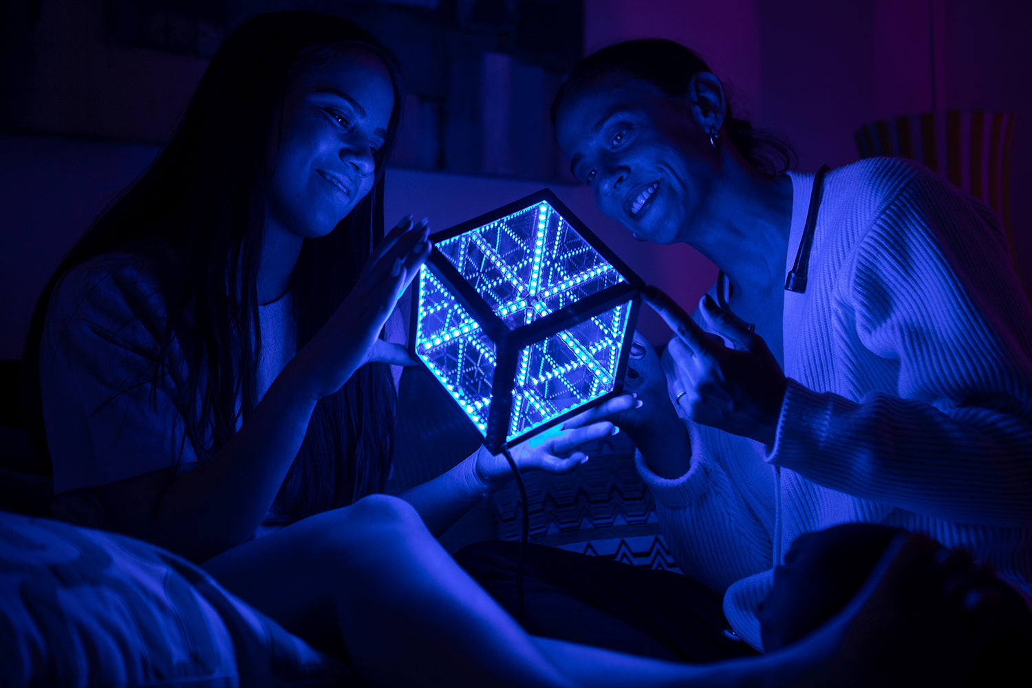 two people holding hypercube nano