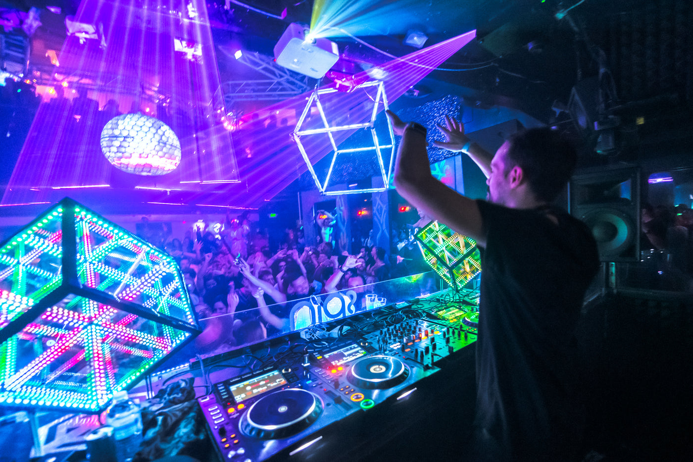 DJ at his table set-up with futuristic lighting solution