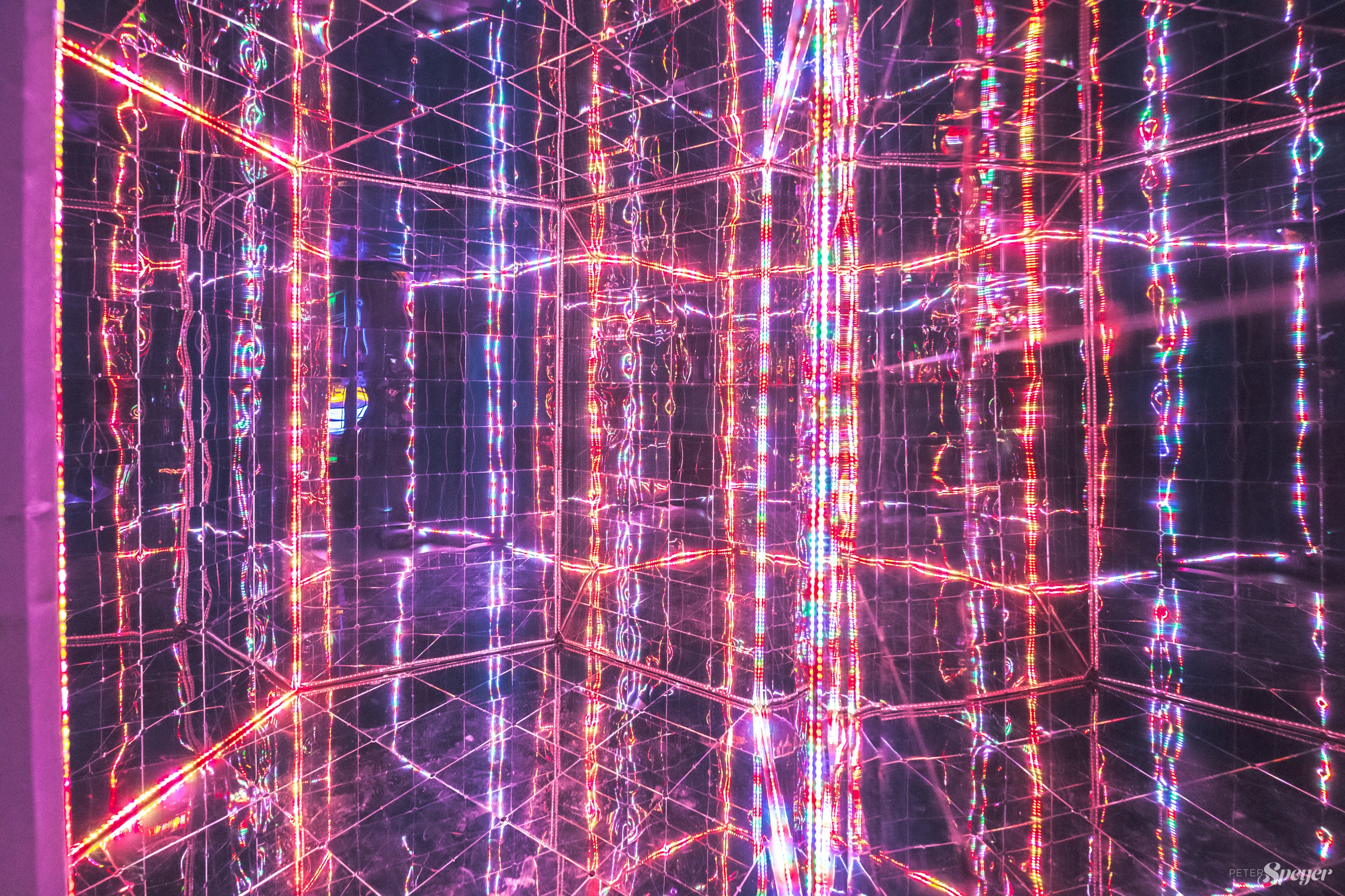 House of mirrors-like experience with a building with color changing lights for entertainment of guests