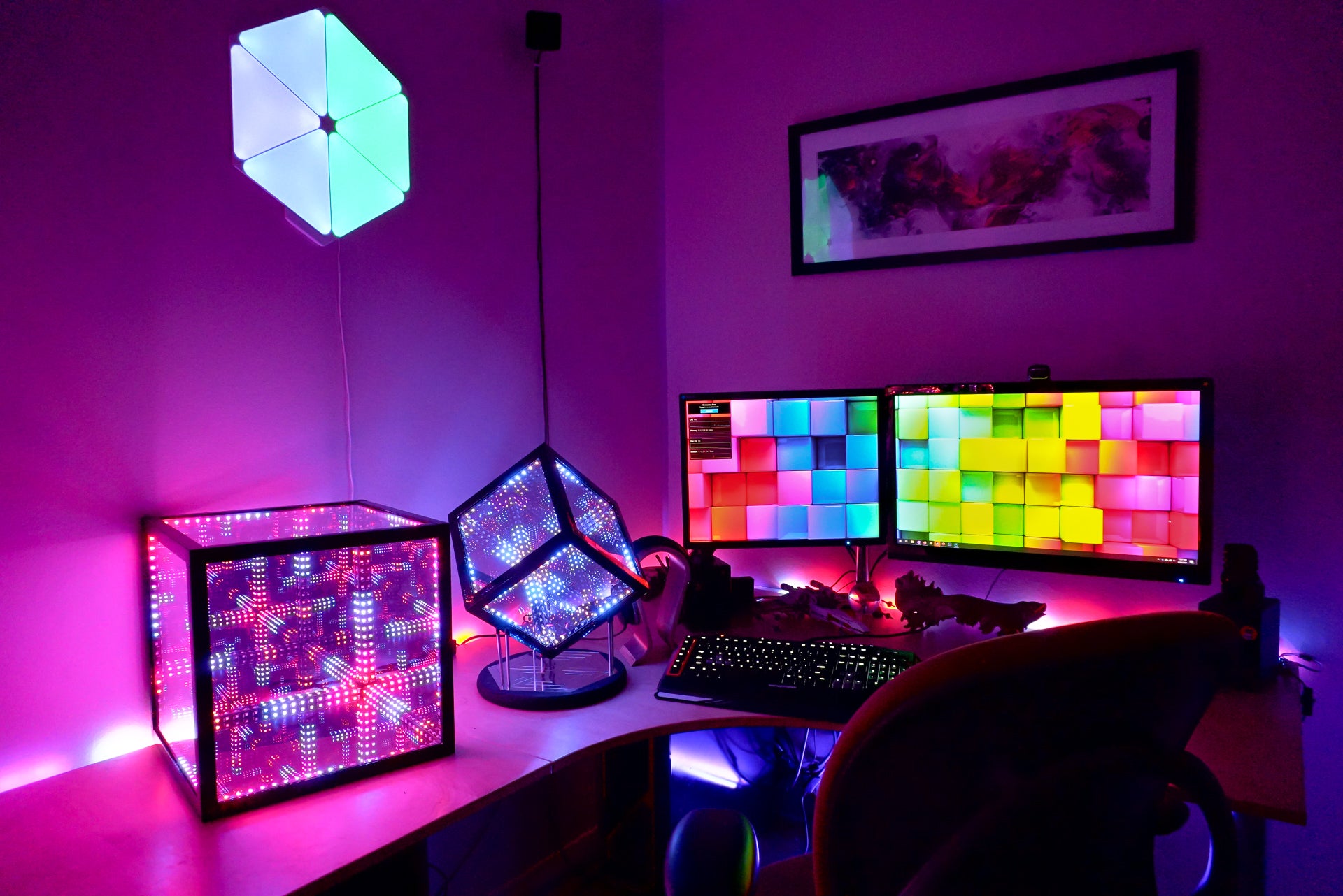 Room corner with a computer desk that has two hypercubes for ambient room lighting in the office and gaming room