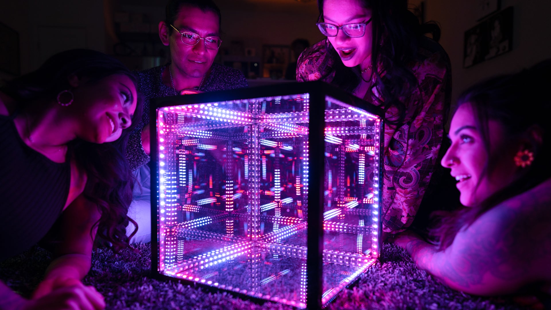hypercube with people surrounding it