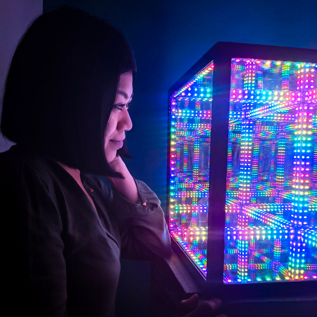 person staring at hypercube 10