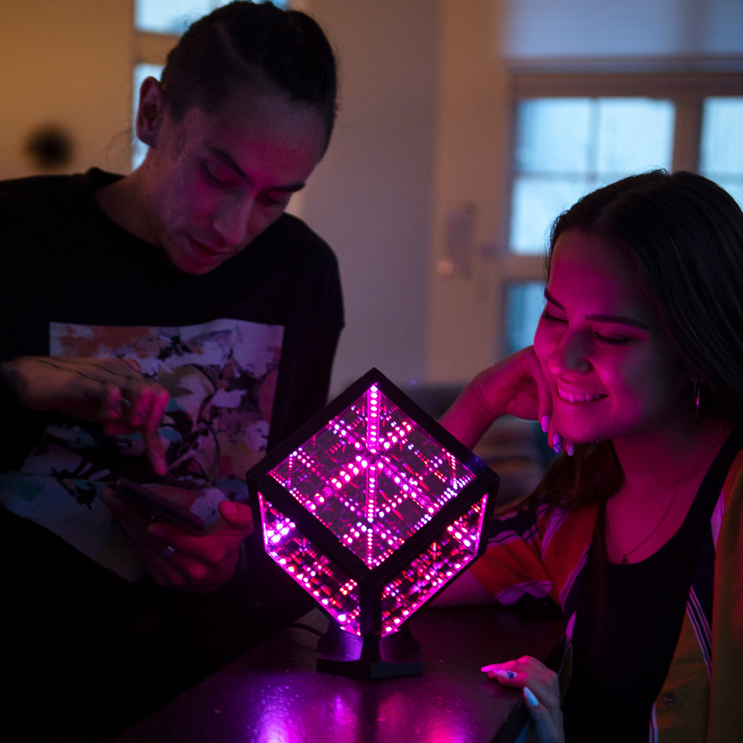 couple looking at hypercube nano on display
